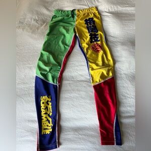 Scramble Brand Brazilian Jiu Jitsu Rainbow spats, size medium.